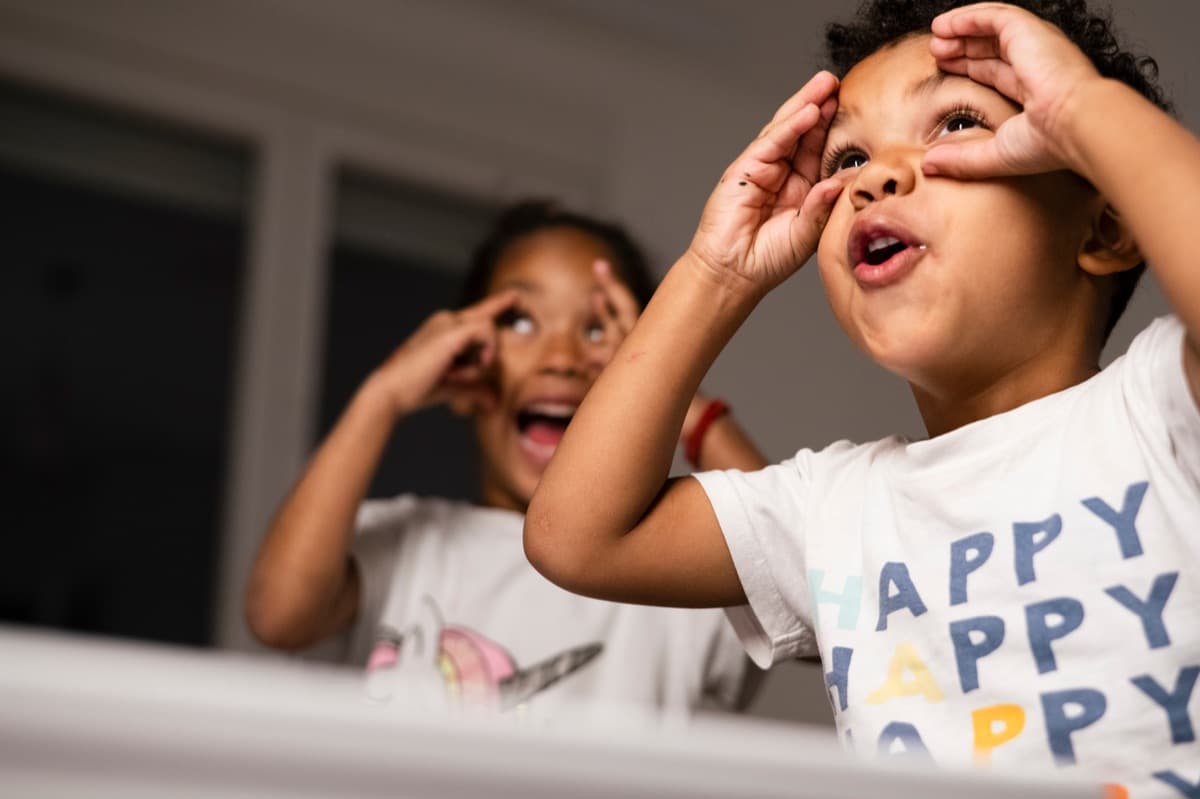 Two children making funny faces